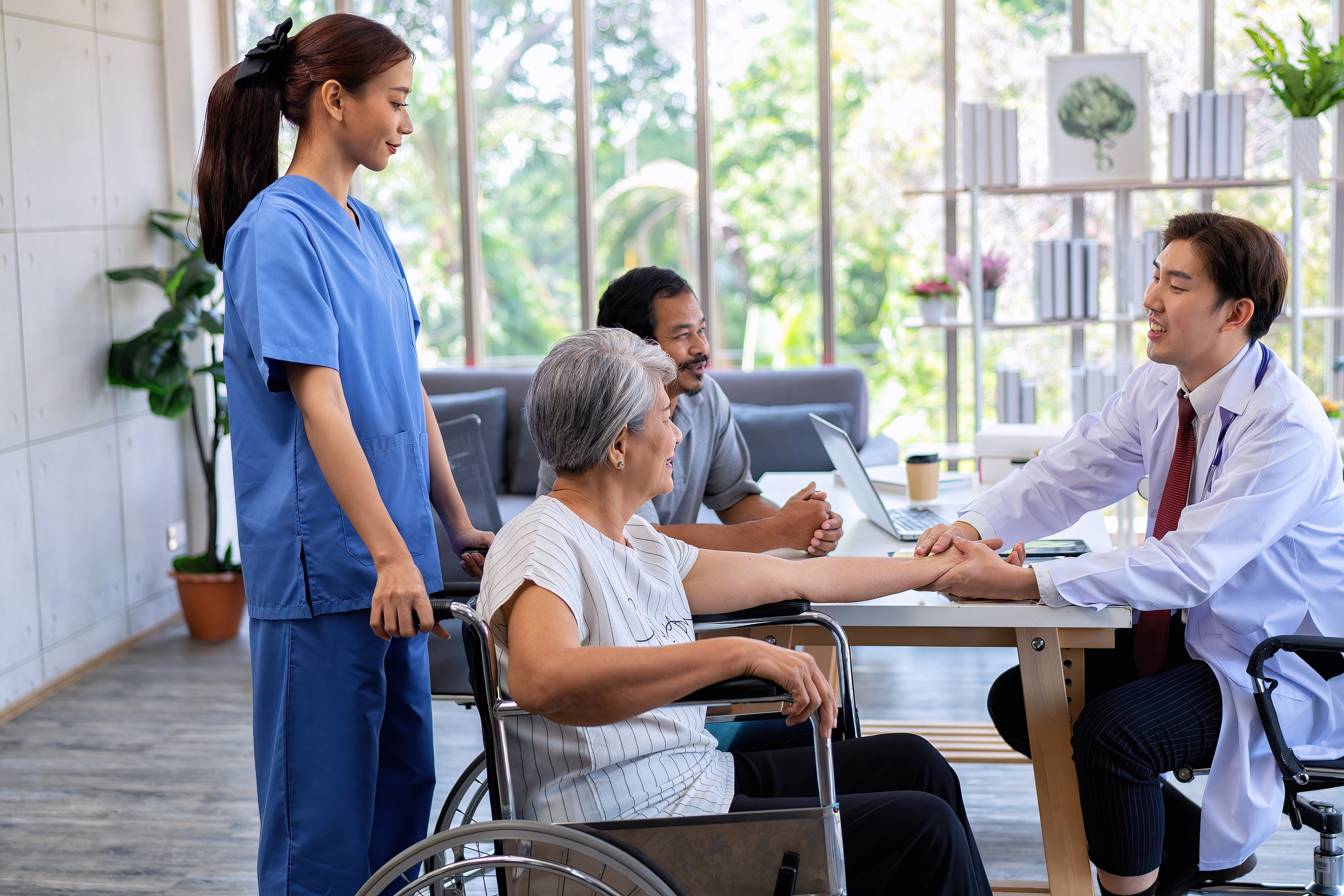 Care consultation with family and senior client discussing in-home support plan